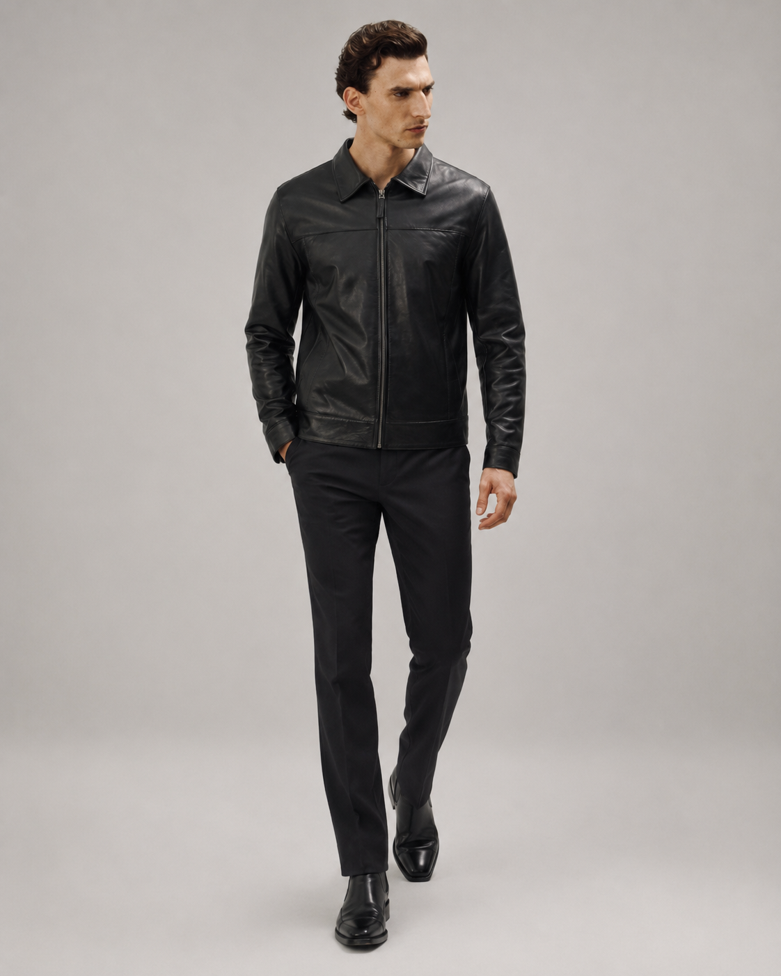 Close-up front view of a man styling the Midnight Black premium nappa leather casual shirt jacket with a turn-down collar and straight zip closure.