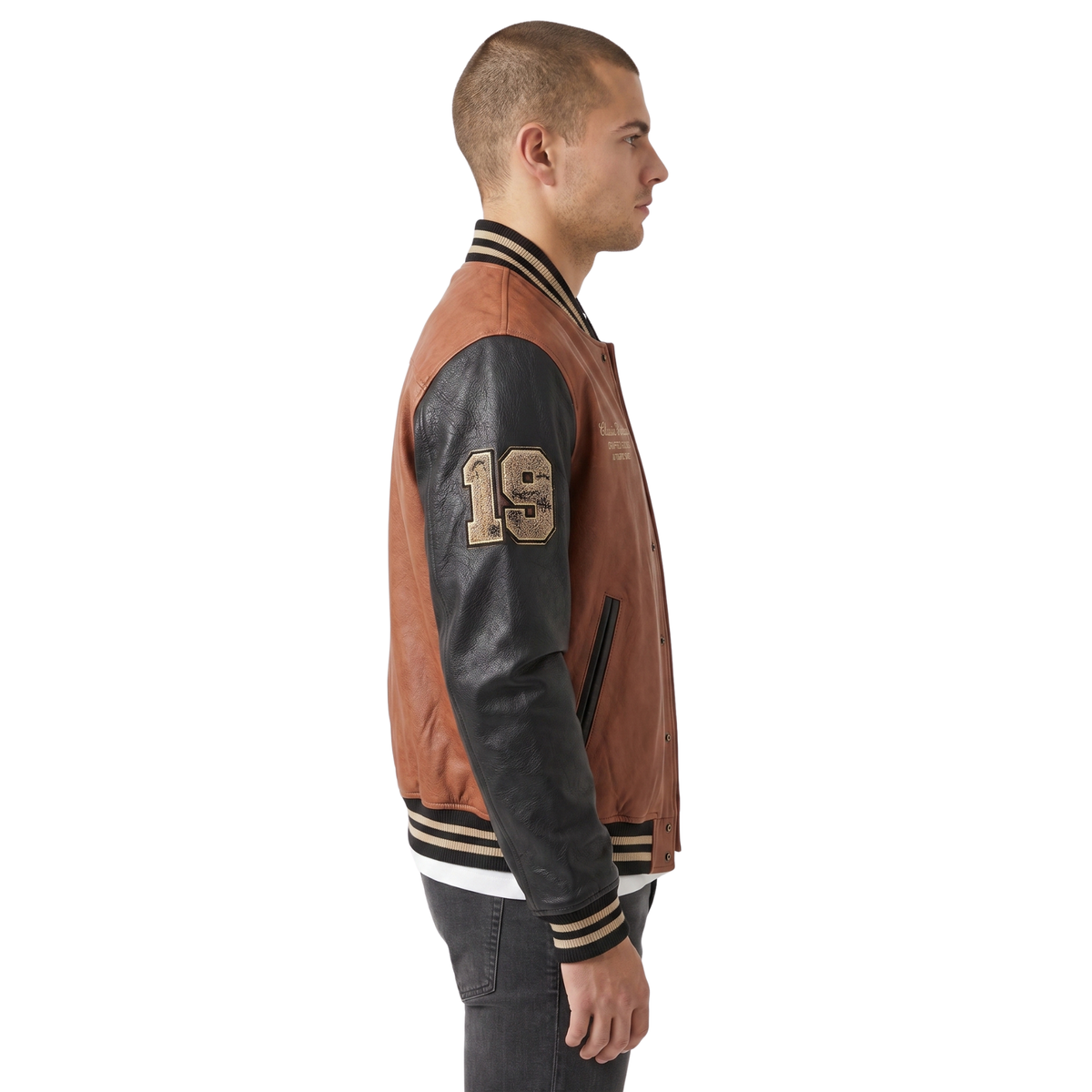 Man wearing a brown and black varsity jacket with number 19 on a white background