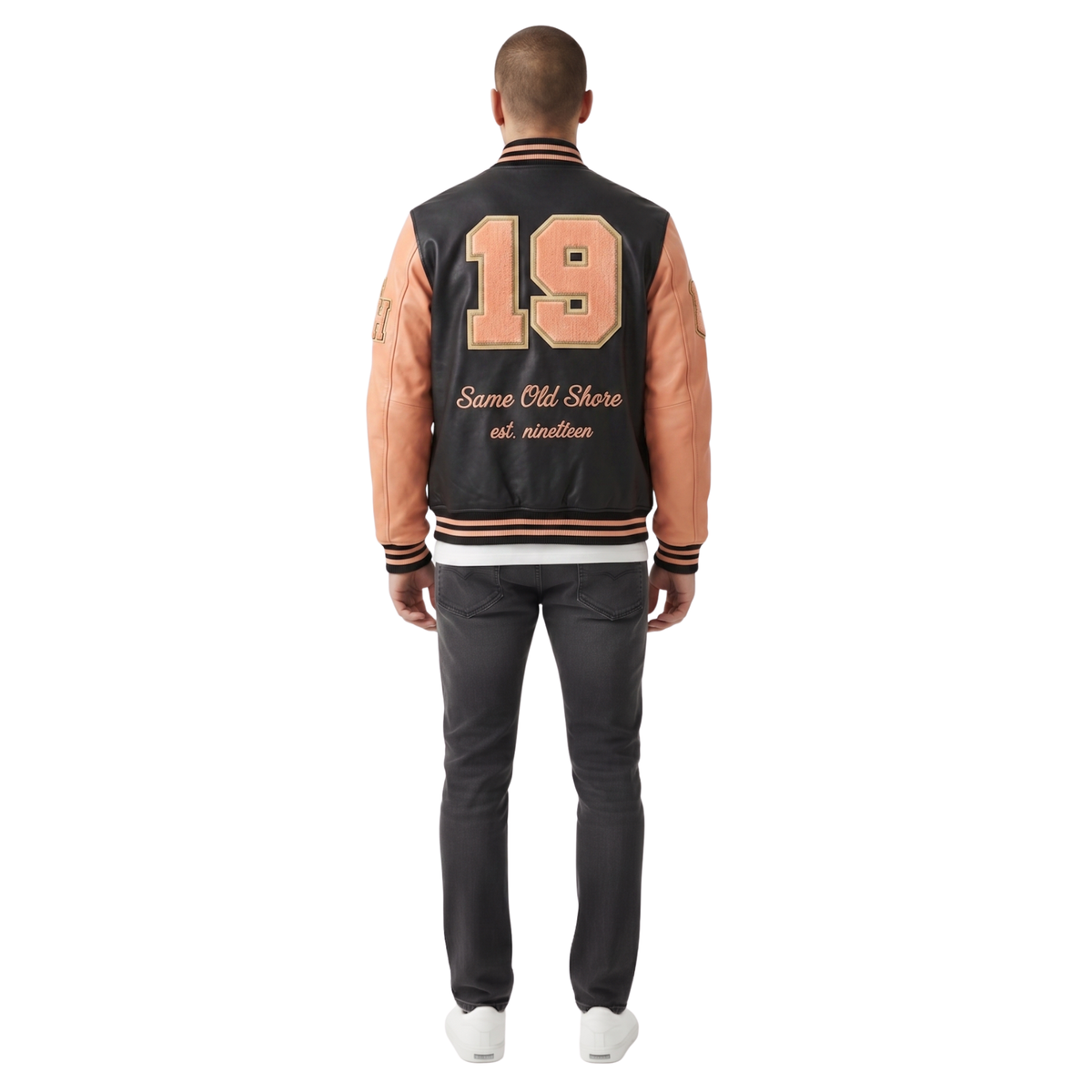 Person wearing a black and pink varsity jacket with the number 19 on the back.