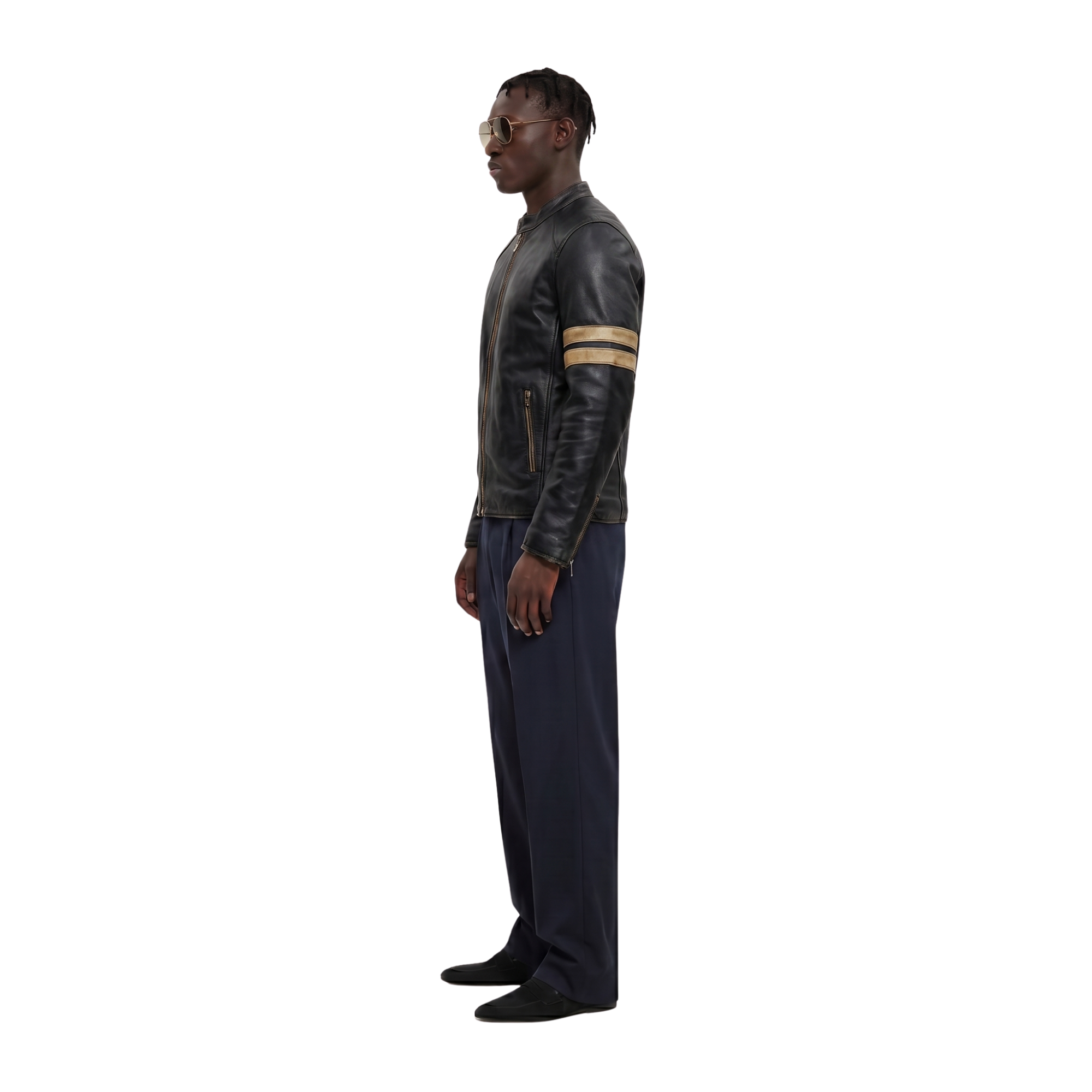 Man in black leather jacket with tan stripes, navy pants, and sunglasses, side profile