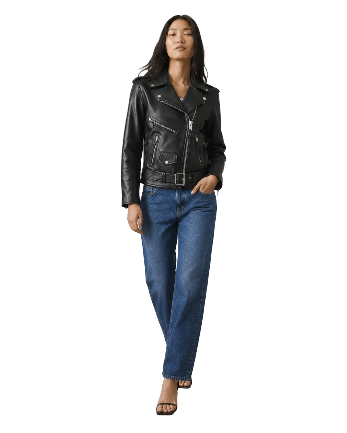 Woman in black leather moto jacket with belt, paired with blue jeans and heels