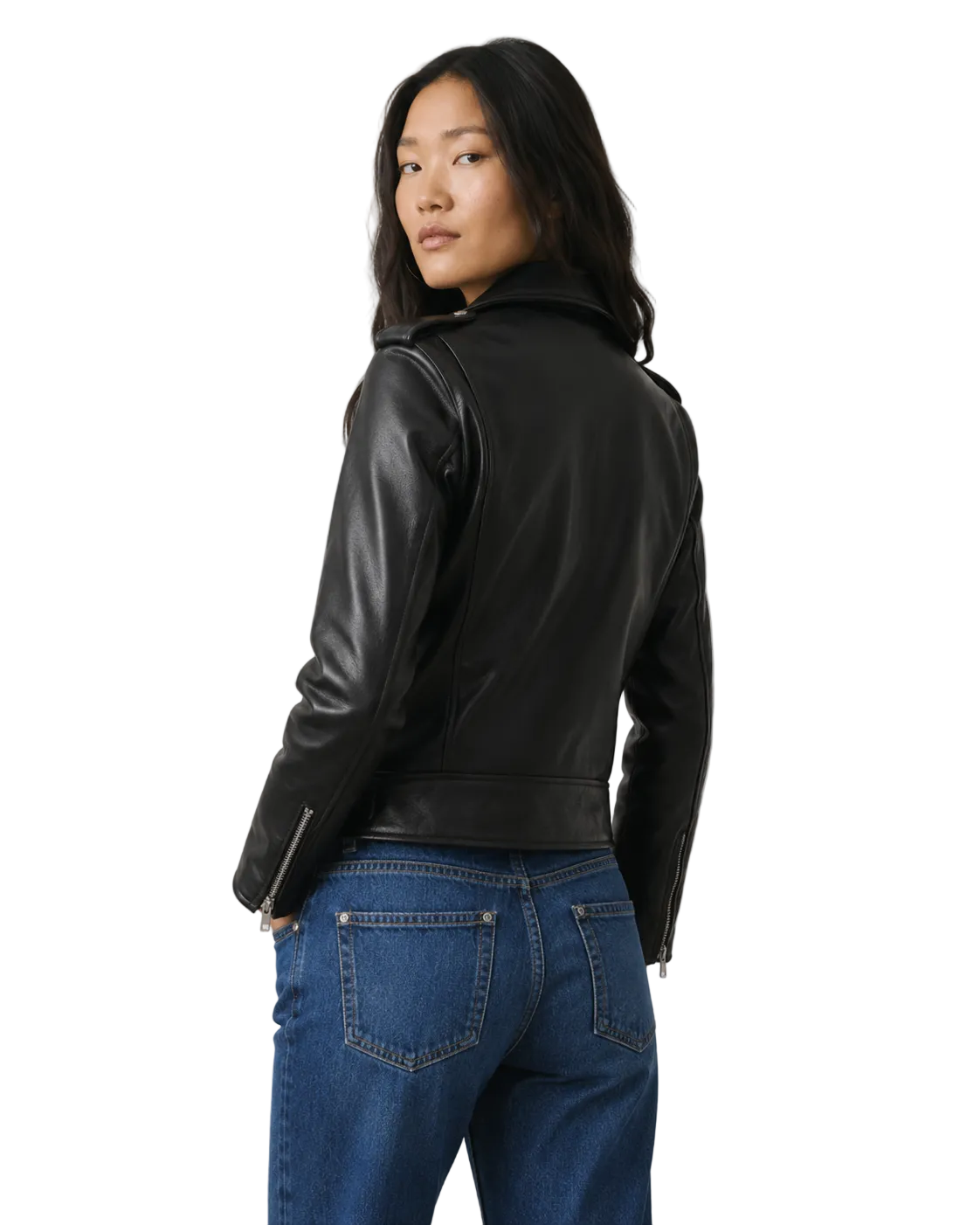Woman wearing black leather moto jacket with zipper details, paired with blue jeans, back view