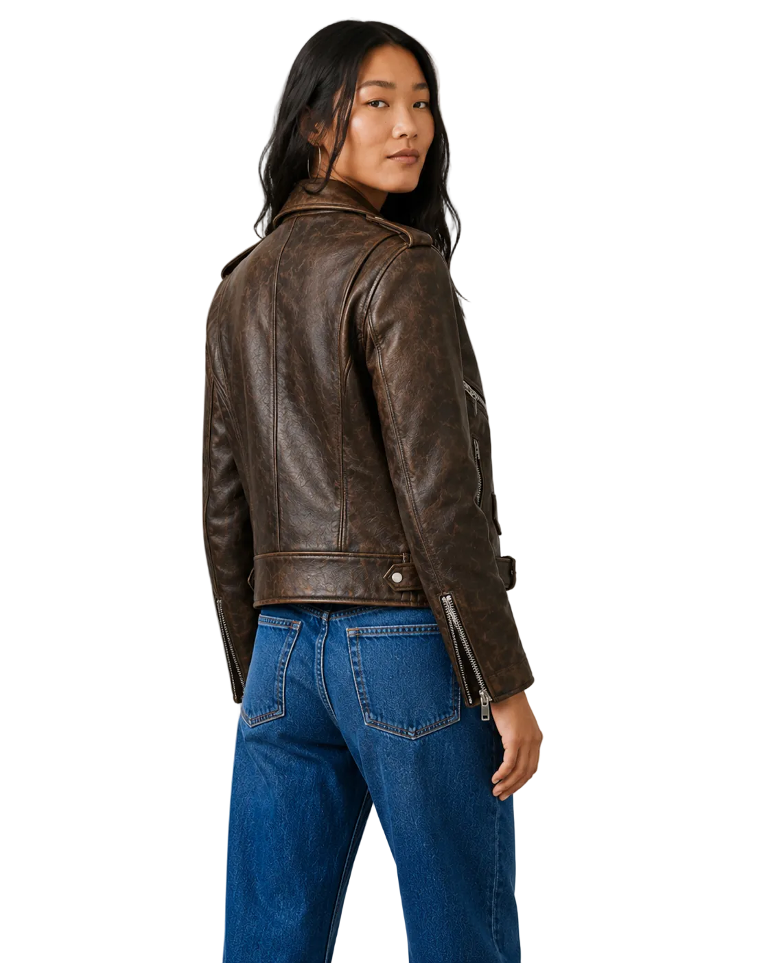 Woman wearing distressed brown leather moto jacket with zippers, paired with blue jeans
