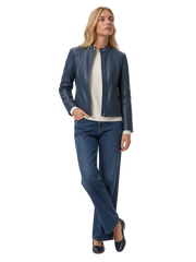 Woman wearing navy blue leather jacket with ribbed sweater and wide-leg jeans, stylish casual outfit