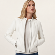 White women's leather moto jacket with zipper details and ribbed sweater underneath
