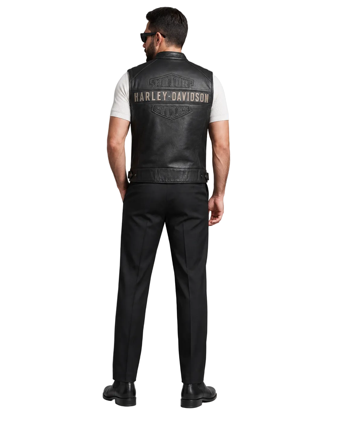 Man wearing black leather Harley-Davidson vest with logo, paired with black pants and shoes