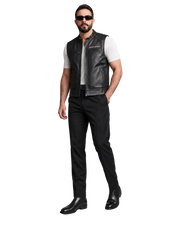Man wearing black leather Harley-Davidson vest, sunglasses, and black pants for a rugged biker look