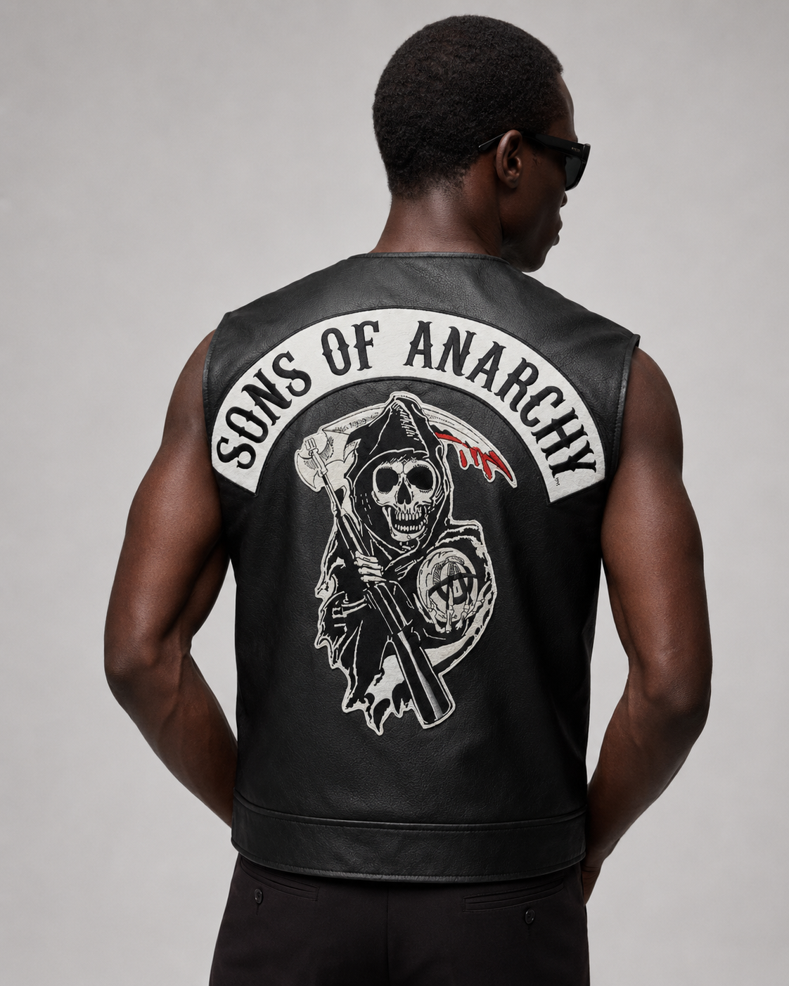 Men's black leather vest with Sons of Anarchy skull patch, biker style
