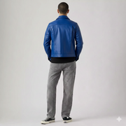 Man wearing blue leather jacket, gray jeans, and black sneakers from behind