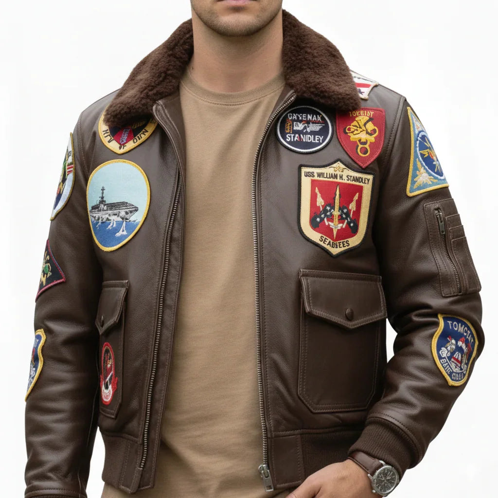 Brown leather flight jacket with military patches, shearling collar, and front pockets