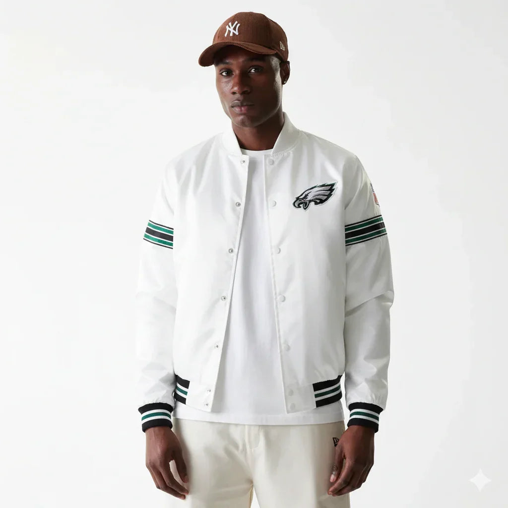 White Philadelphia Eagles varsity jacket with green and black stripes, worn with brown NY cap