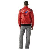 Red leather jacket with 'Good for Health Bad for Education' graphic back design, worn with gray jeans
