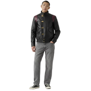Men's black leather jacket with burgundy shoulder panels and gold hardware, styled with gray jeans and sneakers