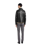 Men's black leather jacket with gray trousers, back view, stylish casual outfit