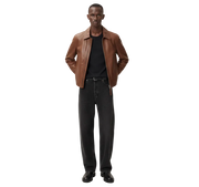 Man wearing brown leather jacket, black tee, and wide-leg jeans for casual style