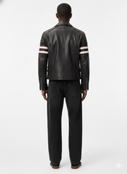 Men's black leather moto jacket with white red stripe sleeves, back view, paired with dark jeans