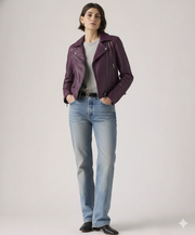 Woman wearing purple leather jacket with blue jeans and black boots