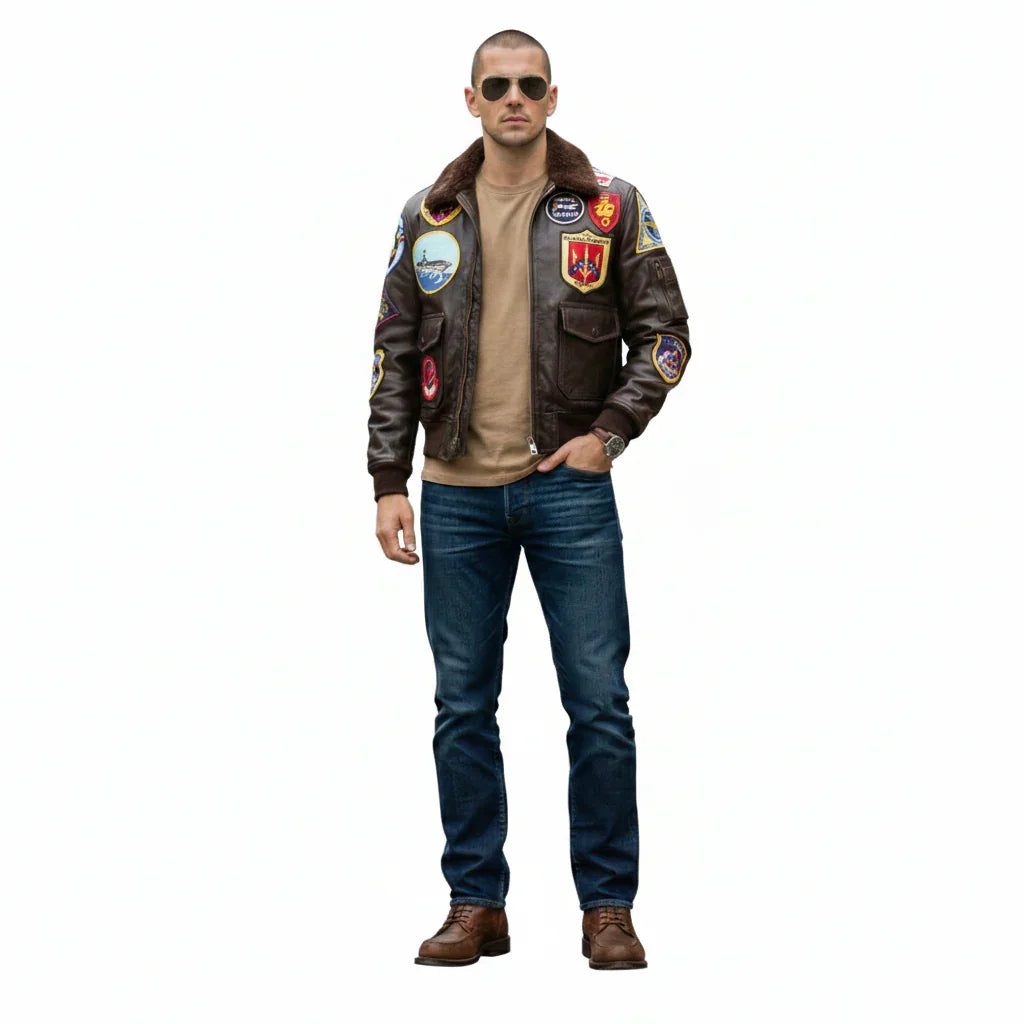 Man wearing vintage bomber jacket with patches, aviator sunglasses, jeans, and brown boots