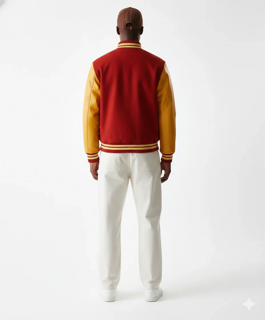 Man wearing red and gold varsity jacket with white pants, back view
