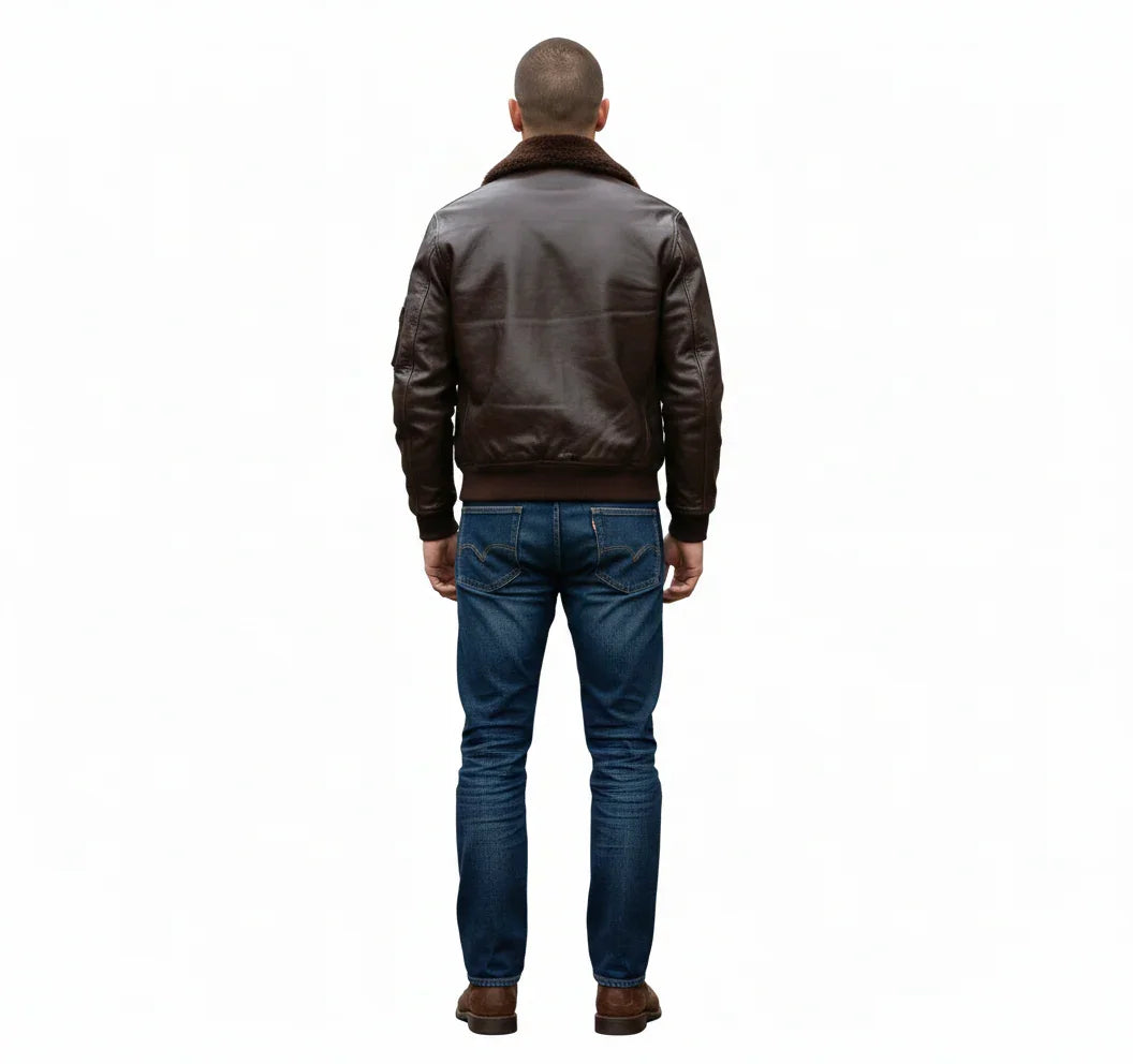 Men's brown leather bomber jacket with shearling collar, back view, paired with blue jeans