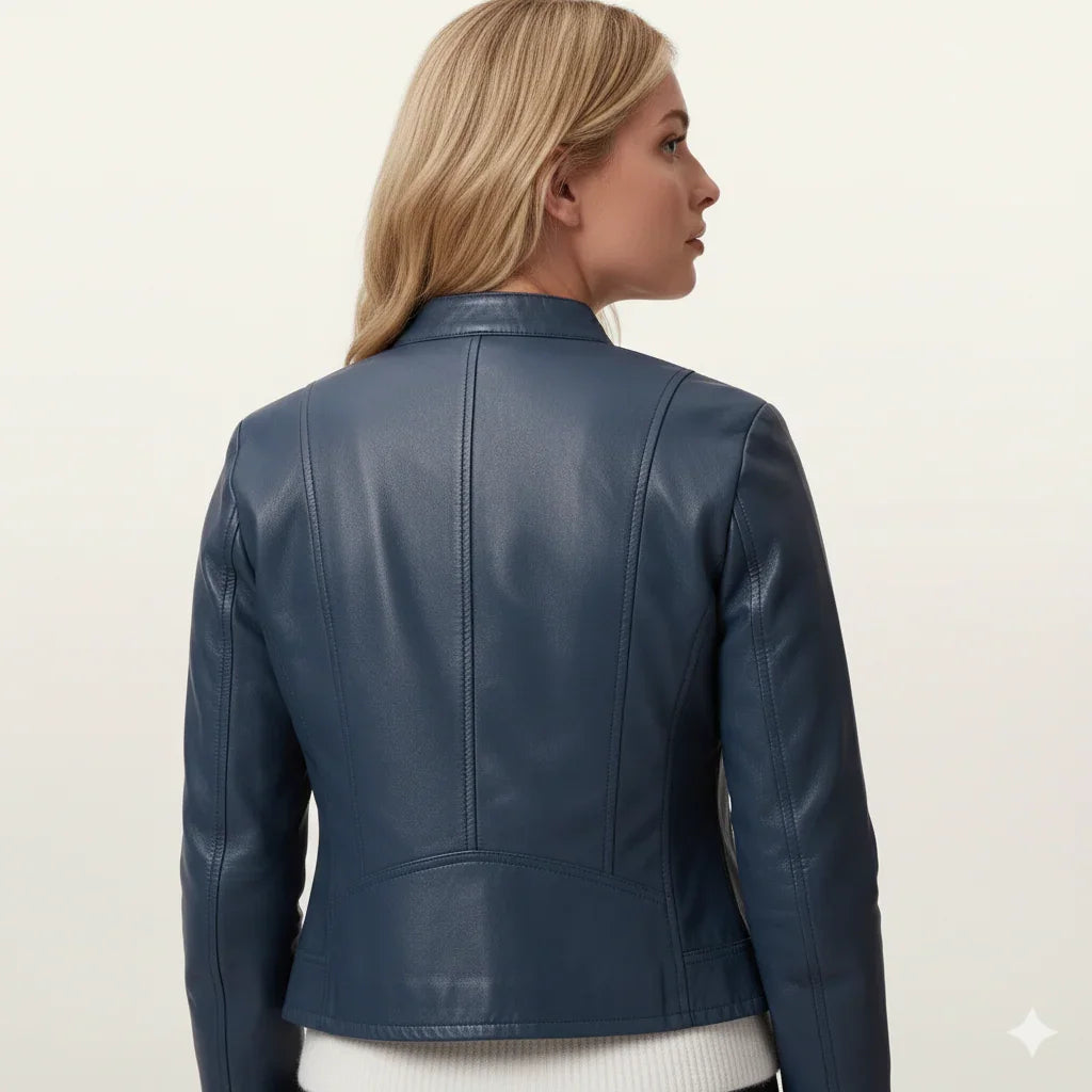 Blue leather jacket with back seam detailing, worn by woman in side profile