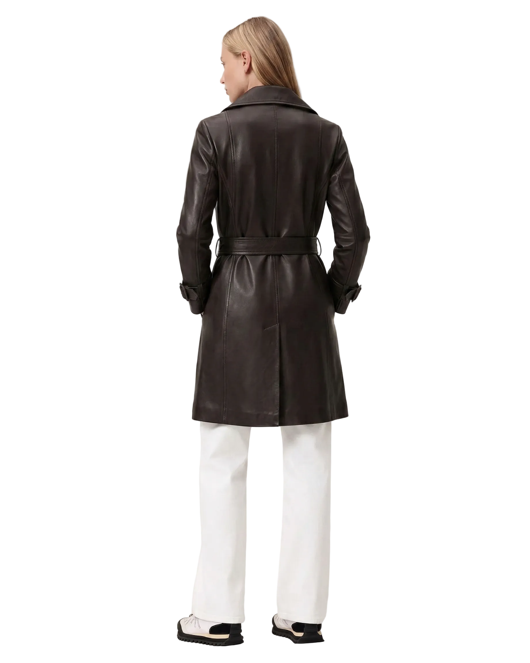 Black leather trench coat with belt, worn with white pants and sneakers, back view