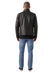 Men's black leather moto jacket with quilted shoulders, back view, paired with blue jeans and sneakers