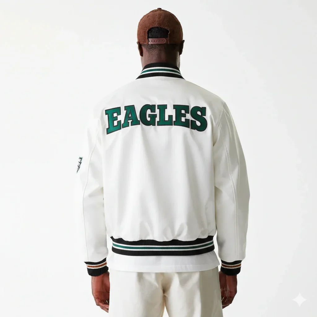 White Eagles varsity jacket with green lettering, striped cuffs and collar, worn with brown cap