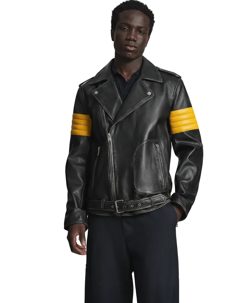 Man wearing a black leather jacket with yellow stripes on a gray background