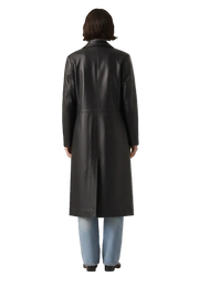 Black leather trench coat with sleek design, paired with blue jeans, viewed from the back.