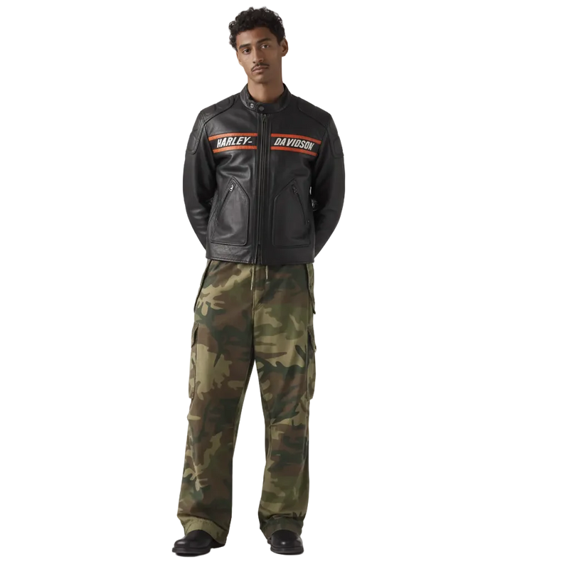 Person wearing a Harley Davidson leather jacket and camouflage pants on a white background