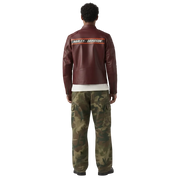 Men's burgundy leather Harley-Davidson jacket with back stripe, paired with camo cargo pants