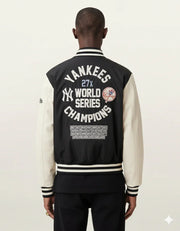 Yankees 27x World Series Champions varsity jacket with championship years, black and cream design