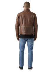 Men's brown leather jacket back view with stitched panels and waist tabs, paired with blue jeans