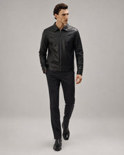 Close-up front view of a man styling the Midnight Black premium nappa leather casual shirt jacket with a turn-down collar and straight zip closure.