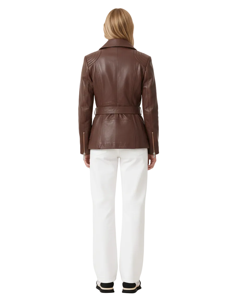 Person wearing a brown leather jacket and white pants on a plain background